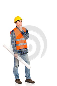 Smiling construction worker holding rolled paper plan.