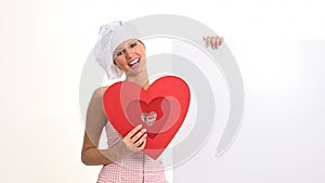 Smiling cook with heart and signboard