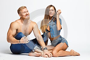 Smiling couple - bearded man and woman in jeans