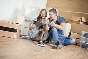 Smiling couple buying new furniture for their home