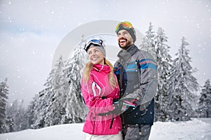 Smiling couple happy together on mountain