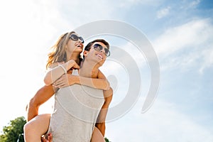 Smiling couple having fun over sky background