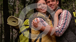 Smiling couple on a hike in the countryside