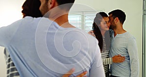 Smiling couple interacting with each other in bathroom