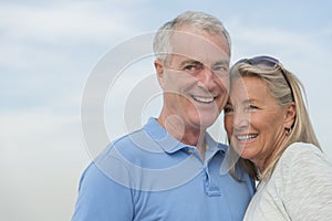 Smiling Couple Looking Away Against Sky