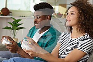 smiling couple playing video games