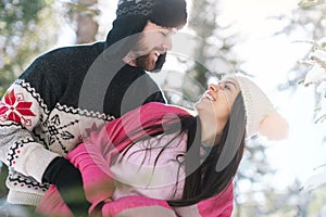 Smiling couple posing in winter