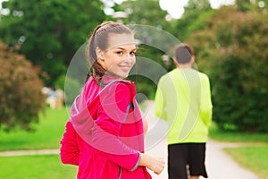 Smiling couple running outdoors