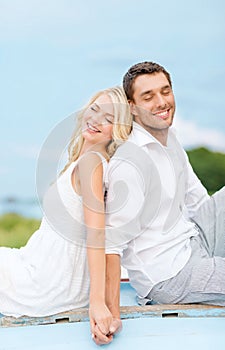 Smiling couple at sea side