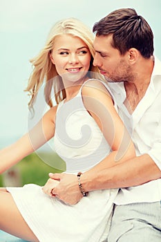 Smiling couple at sea side