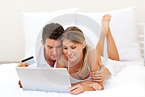 Smiling couple shopping online