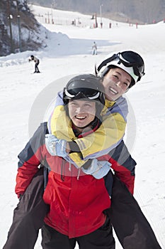 Smiling Couple in Ski Resort