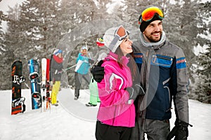 Couple snowboarder enjoying at ski resort in the mountain with f