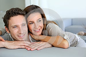 Smiling couple in sofa