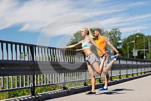 Smiling couple stretching outdoors