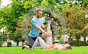 Smiling couple stretching outdoors