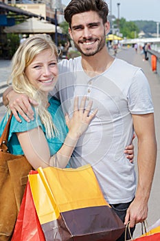 smiling couple strolling in town