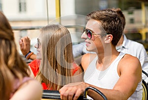 Smiling couple traveling by tour bus