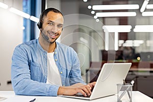 Smiling customer service representative with headset in office