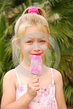 Smiling cute girl with lolly