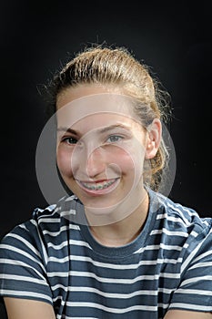 Smiling  cute teenager girl  with dental braces