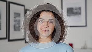 Smiling cute young beautiful hispanic latin woman looking at camera, portrait.