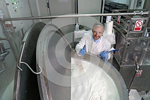 Smiling Dairy Plant Food Technologist Giving Ok Hand Sign