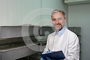 Smiling Dairy Plant Food Technologist at Work