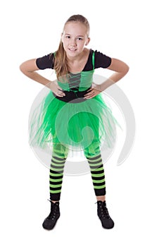 Smiling dancer in green tutu skirt standing