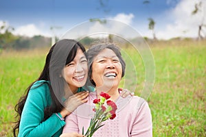 Smiling daughter and her mother