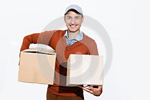 Smiling delivery man giving cardbox on white background