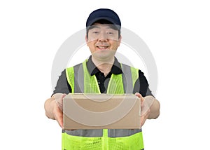 Smiling delivery man holding a big parcel isolated on white background