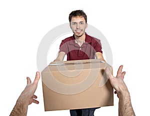 Smiling delivery man holding pile of cardboard boxes on a white background