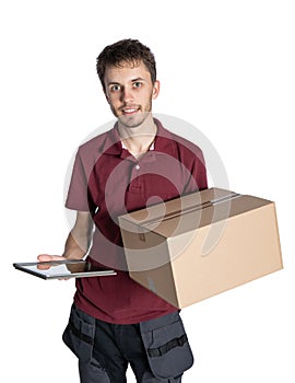 Smiling delivery man holding pile of cardboard boxes on a white background