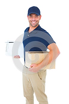 Smiling delivery man with package and clipboard