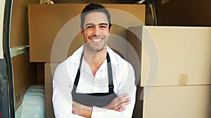 Smiling delivery man sitting in his van