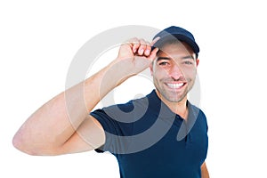 Smiling delivery man wearing cap on white background