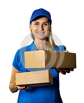 Smiling delivery woman in blue uniform giving cardboard package. isolated on white background