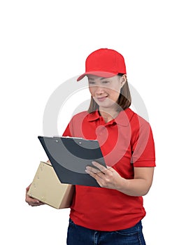 Smiling delivery woman in red uniform giving parcel boxes and clipboard, isolated on white background