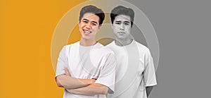 Smiling, despaired and unhappy millennial asian guy suffer from depression on yellow and gray background