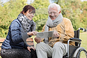 Smiling didabled man and caregiver