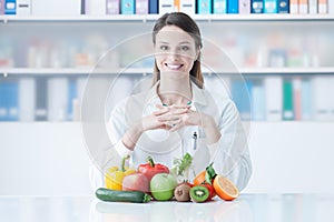 Smiling dietician with healthy vegetables photo