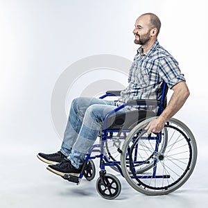 Smiling disabled man sitting in a wheelchair