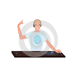 Smiling disk jockey with headphones mixing tracks at turntable on white background