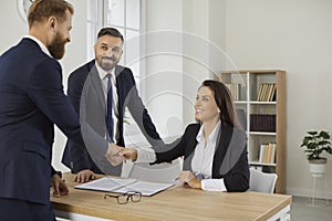 Smiling diverse businesspeople handshake get acquainted