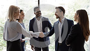 Diverse businesspeople handshake getting acquainted in office