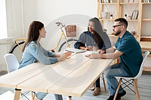 Smiling diverse hr managers listening to candidate at meeting