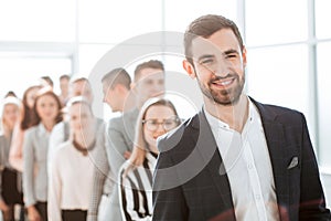 Smiling diverse people standing in office corridor
