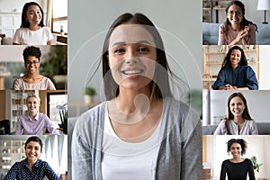 Smiling diverse women engaged in team video call at home