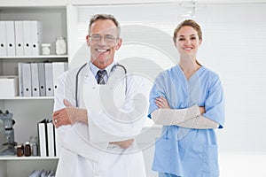 Smiling doctor with fellow co worker